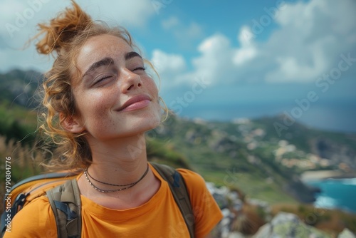 A radiant woman smiles broadly, finding joy in the stunning mountainous landscape around her