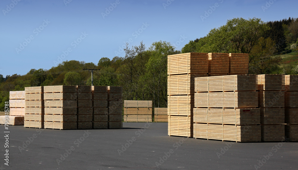 Stacks of timber planks on a sawmill storage area in Germany Stacks of timber planks on a sawmill storage area in Germany