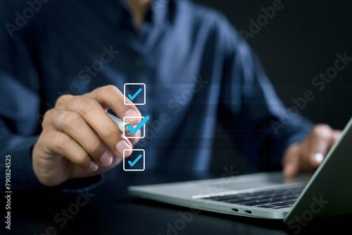Businessman checking mark on check box to approved documents . management approval and and project approve concept. © A Stockphoto