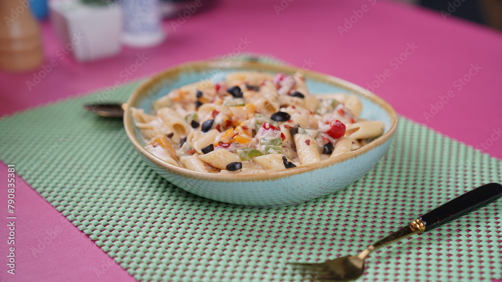 Delicious Pasta Preparation - International Cuisine - Served Beautifully on a pink matt - Ready to Eat Delicious Pasta Preparation - International Cuisine - Served Beautifully on a pink matt - Ready to Eat