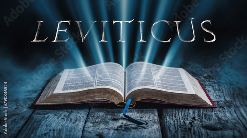 Book of Leviticus. Open bible revealing the name of the book of the bible in a epic cinematic presentation. Ideal for slideshows, bible study, banners, landing pages, christian intros and much more photo
