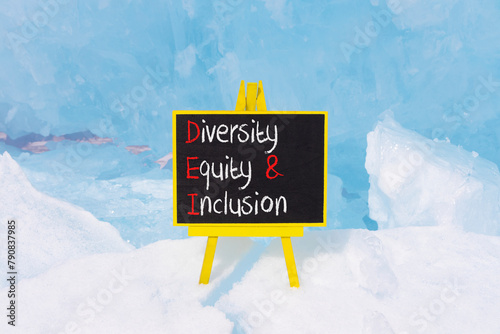 DEI diversity equity and inclusion symbol. Concept words DEI diversity equity and inclusion on blackboard. Beautiful ice background. Business DEI diversity equity and inclusion concept. Copy space.