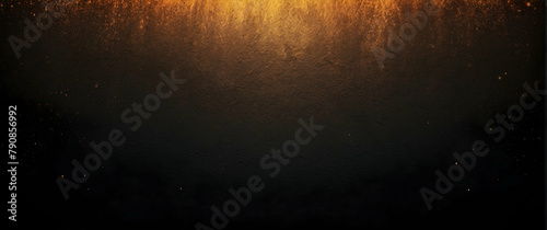 Golden light shining through a textured dark surface creates a mysterious and luxurious ambience