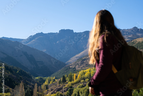 Mountain landscape with a woman out of focus and the Cerro Corona de Huinganco in Patagonia, Neuquén province. photo