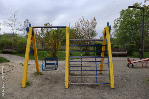 Outdoor playground for kids. Swing equipment for children outdoor.