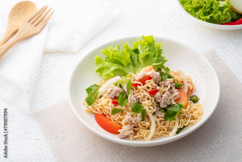instant noodle spicy salad.Thai hot and sour noodle salad with minced pork that is very flavorful and addictive