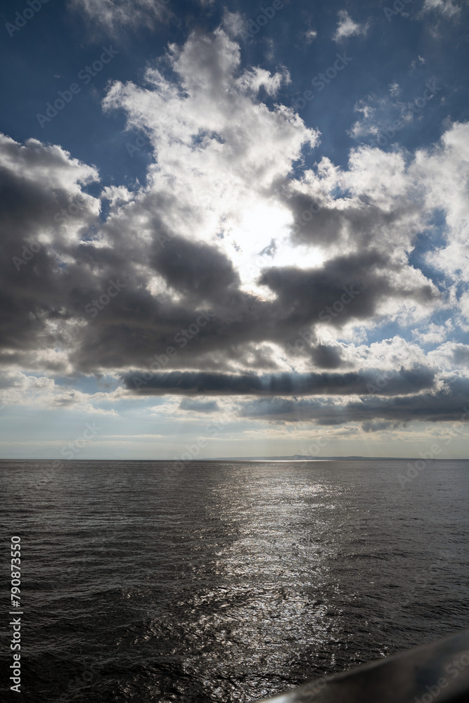 Storm Clouds Over warm mediterranean Sea Water. Stylized wide angle seascape. Dramatic sky in zante, Greece