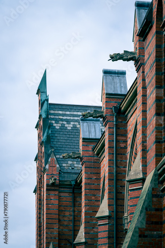 Gargoyles at the facade of the church Allhelgonakyrkan in Lund Sweden photo