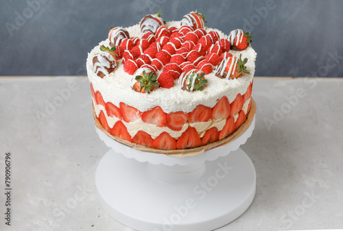 French Cake Fraisier With Fresh Strawberries And Raspberies On Turntable, Grey Background. Side View.