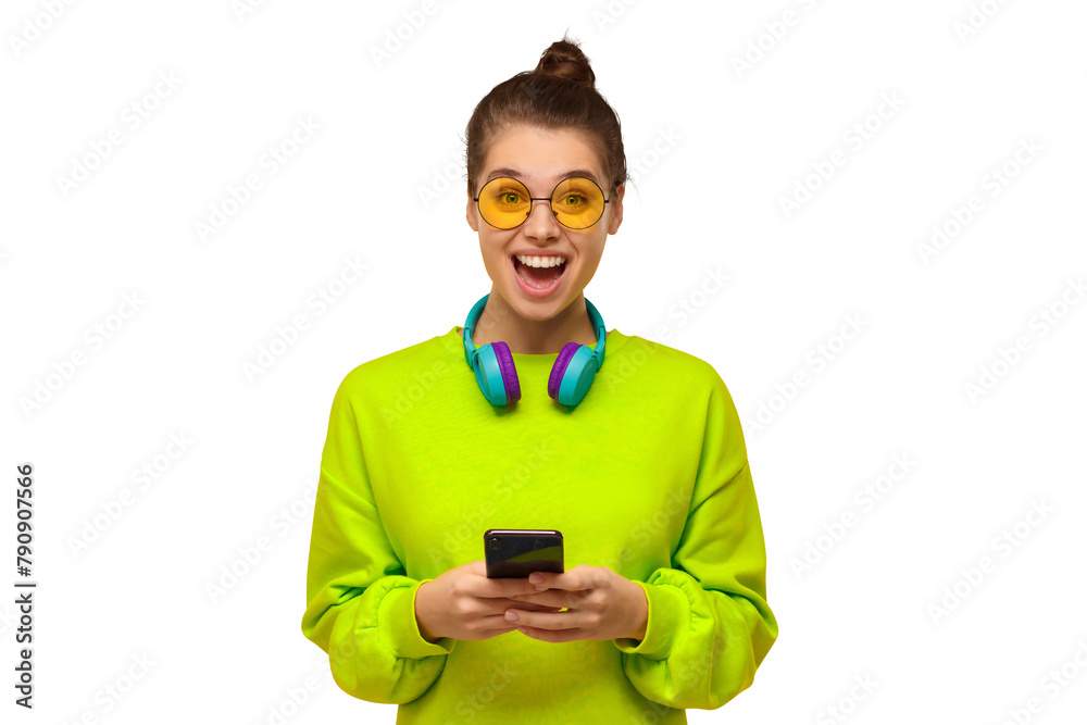 Φωτογραφία Young teenage girl in green neon top and eyeglasses, wearing blue wireless headp