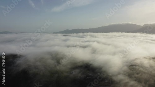 Above the Mountains with Clouds below at Early morning