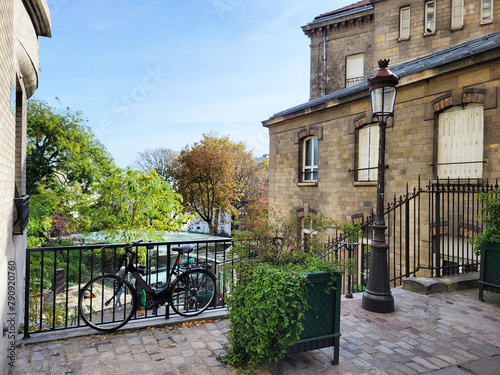 A lamp and bicycle adorn the top of a staircase in Montmartre, Paris, France. 