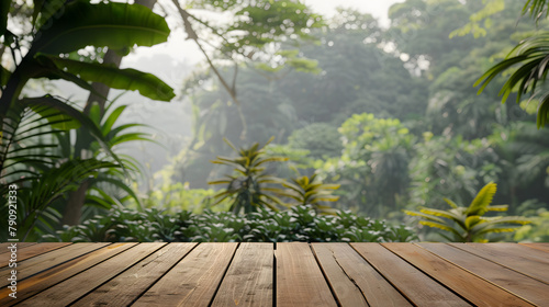 an empty sleek wooden surface set against the soft blur jungle background