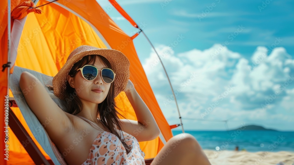 Fototapeta premium A Woman Relaxing on the Beach