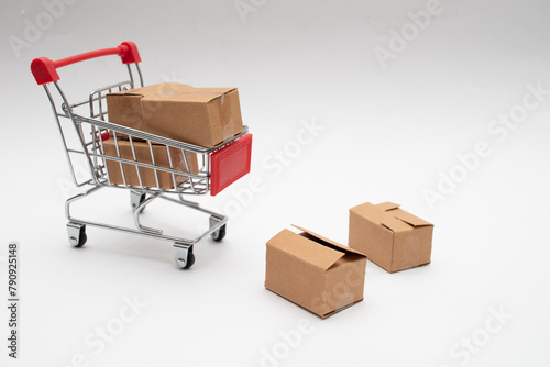 Cardboard boxes in a small shopping cart