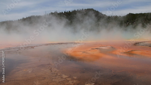 Фотография A large orange brown color geothermal spring in Wyoming