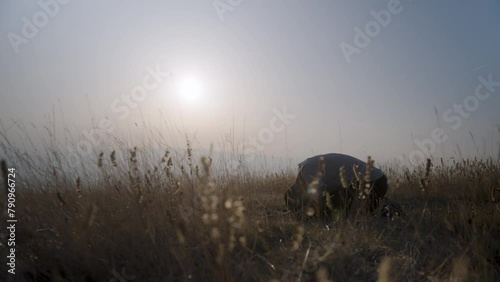 Muslim man praying in nature