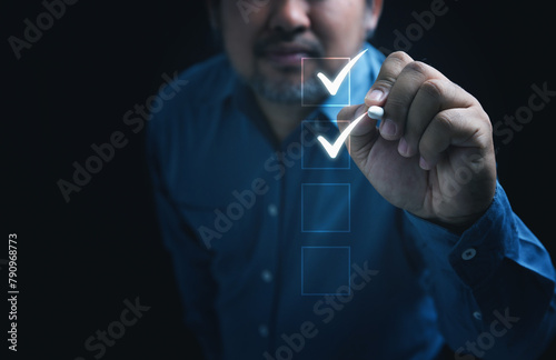 Businessman touching on the mark in the checkbox for quality document control checklist and business approve project, checklist, validation concept. With space designed for business.