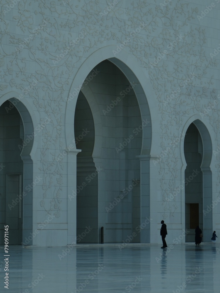 Man standing in front of Sheikh Zayed Grand Mosque