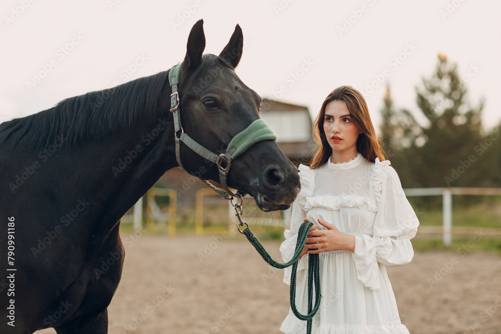 Obraz premium Woman with her horse at outdoors ranch