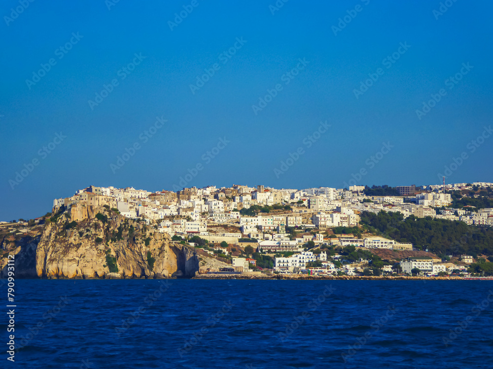 Scenic view of the city of Peschici along the coast of Puglia, Foggia, Italy, Europe. Vacation in Gargano National Park in the Mediterranean Adriatic Sea. Paradise destination in summer