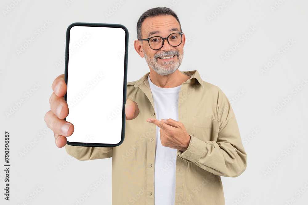 Elderly man showing a smartphone screen on white background Elderly man showing a smartphone screen on white background
