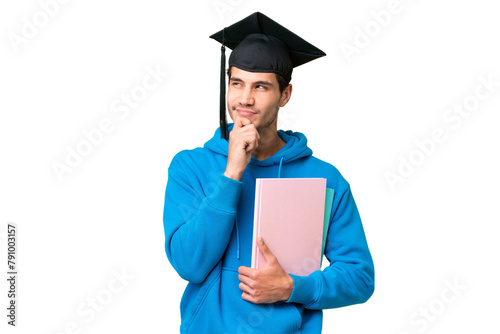 Young university graduate man over isolated background having doubts and thinking