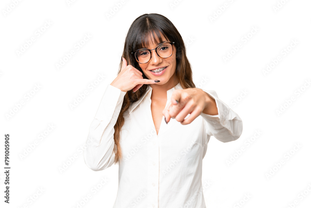 Young caucasian woman over isolated chroma key background making phone gesture and pointing front Young caucasian woman over isolated chroma key background making phone gesture and pointing front