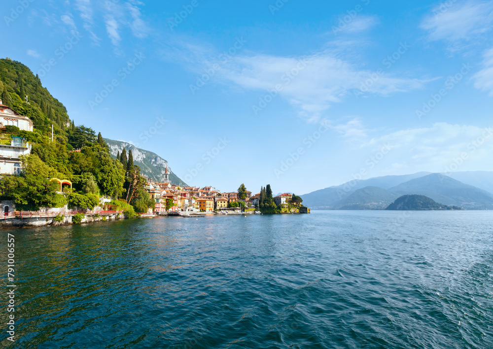 Town on Lake Como coast (Italy). Summer view from ship board