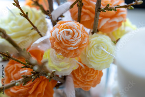 Orange and yellow rose shaped white soy wax candles