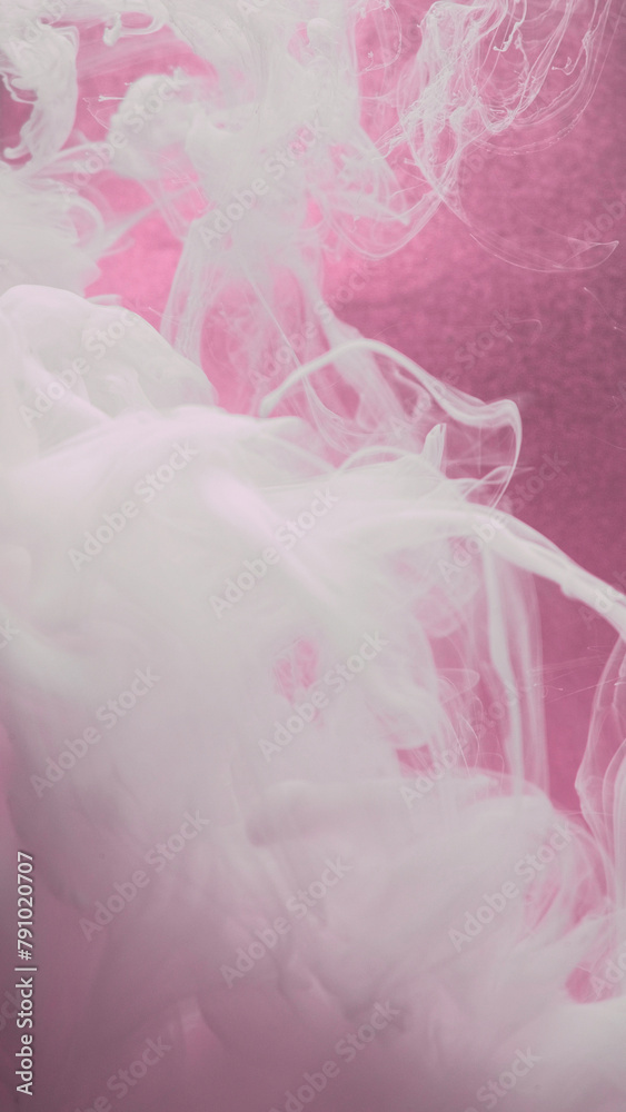 Ink cloud flow. Smoke paint. White silk water fluid haze texture wave motion on defocused pink color grain abstract art background.