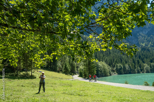 active recreation on the lake in the alpine mountains