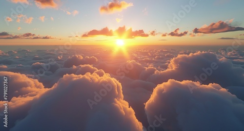   The sun sets behind clouds in the sky, viewed from a plane window on a sunny day photo