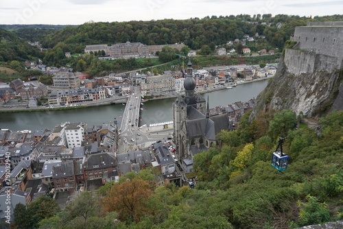 view of the town of Dinant in Belgium on the Meuse river from the old stone fort above  with the gondola © poupine