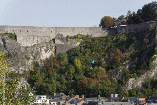 view of the town of Dinant in Belgium on the Meuse river with the old stone fort above 
