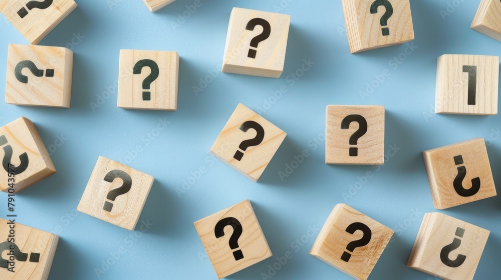 Blocks with question marks on a blue background Blocks with question marks on a blue background