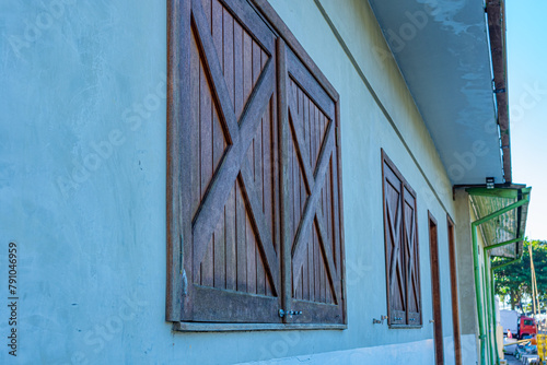 casa à beira mar com janelas de madeira fechadas photo