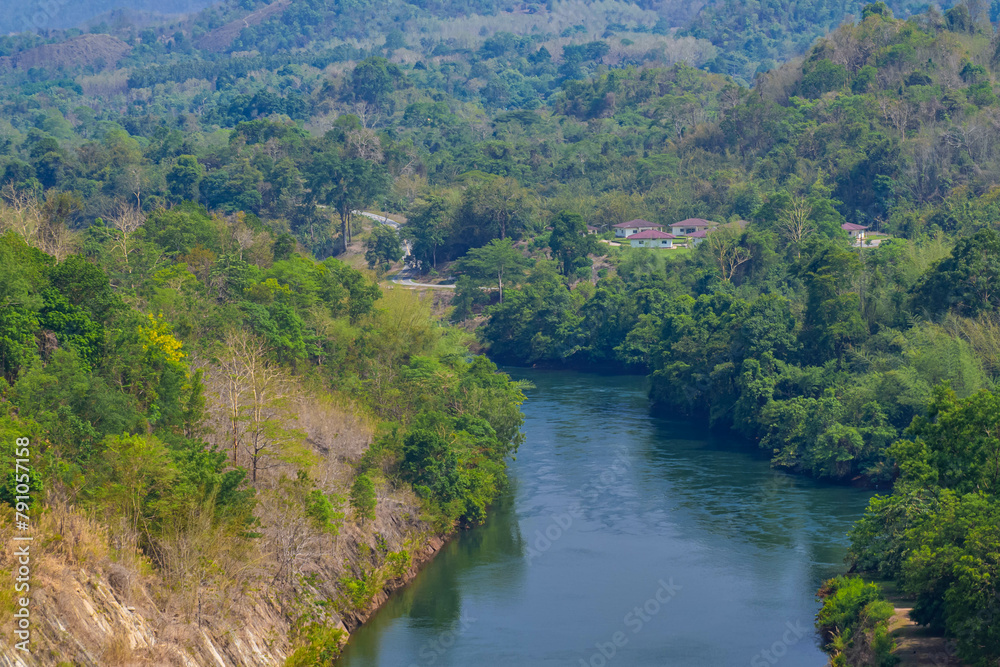 An aerial view of the dam-caused canal in Thailand's national park, with a mountain the background.  Bird eye view.