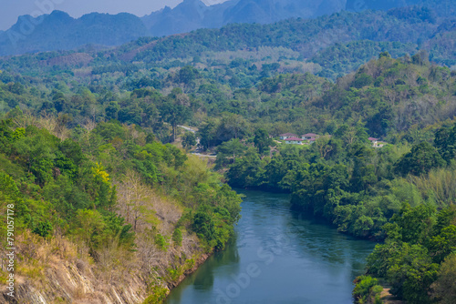 An aerial view of the dam-caused canal in Thailand s national park  with a mountain the background.  Bird eye view.