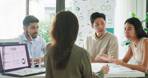 Group diverse Asia businesspeople talk ESG strategies risk management workshop, SDGs report, global warming, green finance and investment and net zero waste lifestyles in boardroom training building.