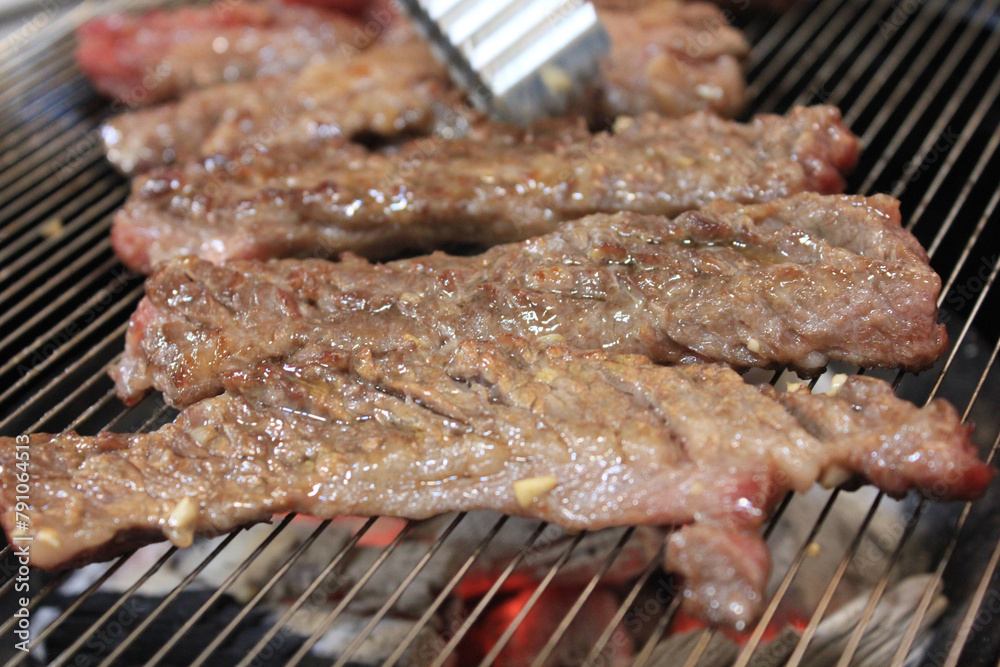 delicious grilled meat on barbecue