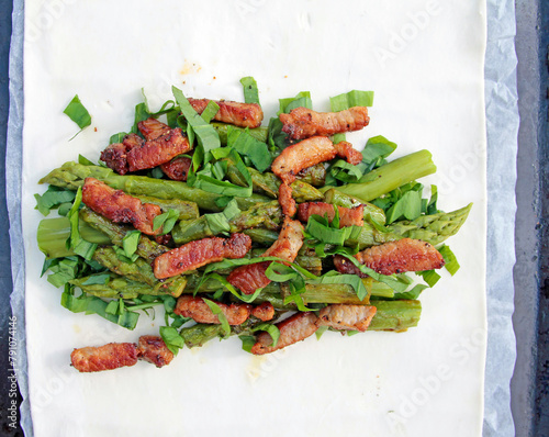 Stuffed puff pastry with asparagus, parmesan, wild garlic and 
pieces of meat,
 photo