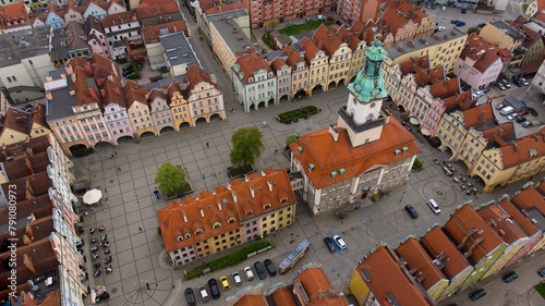 Bird's-eye view captures Jelenia Góra's bustling market square and 18th-century town hall. © Grzegorz