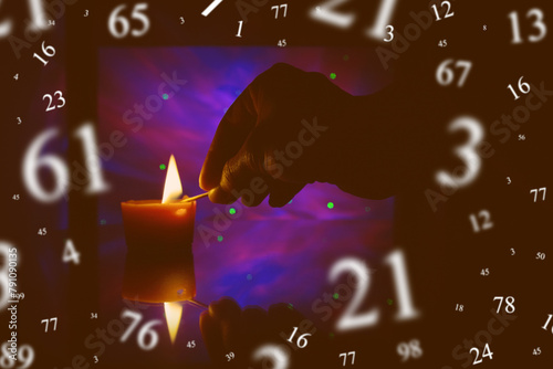 Numerology, astrology concept. Dark, candle, hand.