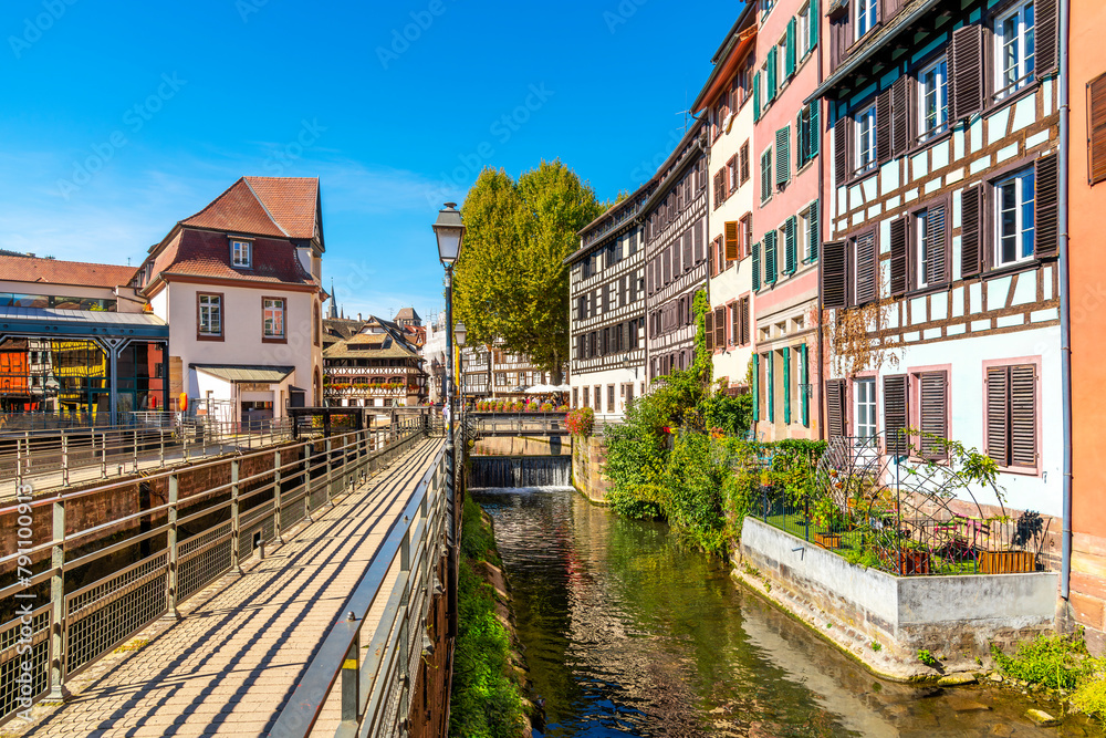 Picturesque half timber, medieval waterfront buildings along the river Ill, in the Petite France district of the Alsatian city of Strasbourg, France.