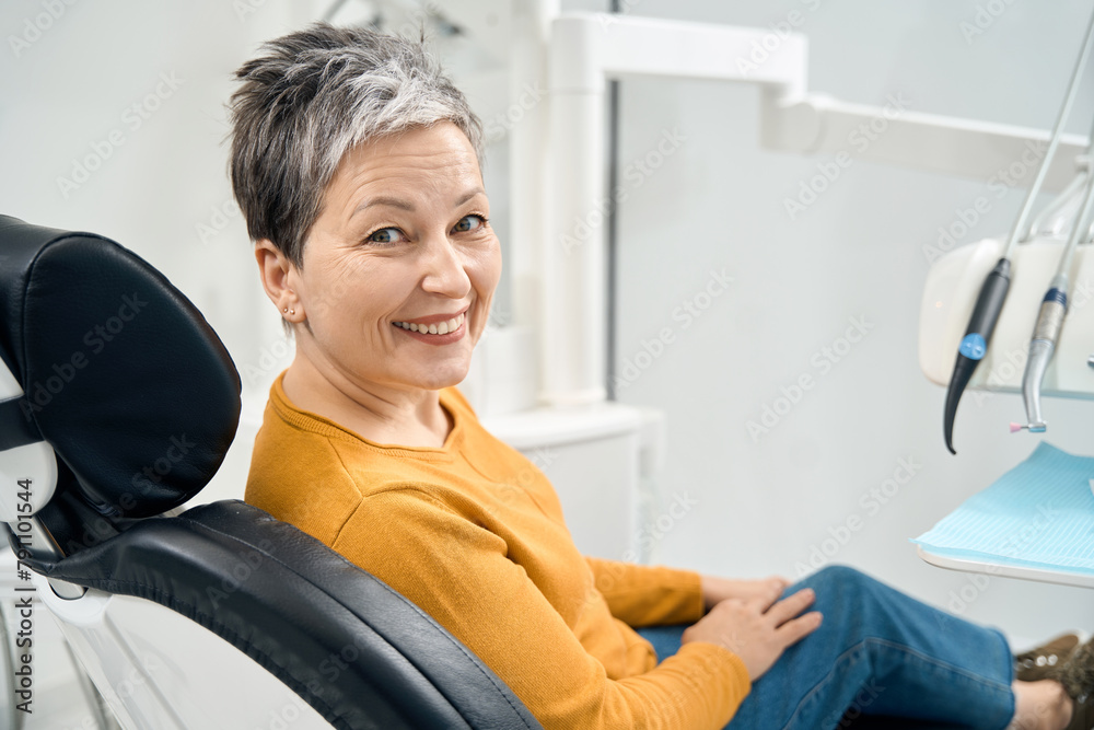 Senior woman smiling showing her white and healthy teeth Senior woman smiling showing her white and healthy teeth