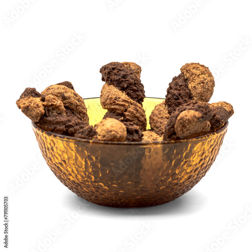 bowl of Italian biscuits with wholemeal flour,chocolate chips and buckwheat on white background