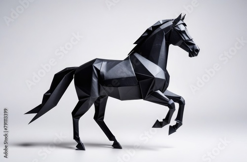 Black horse made of paper on a white background, origami.