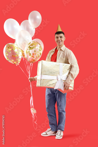 Young man with bunch of bal...