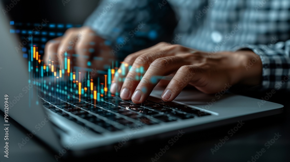 Fototapeta premium Businessman working on laptop analyzing market data at the office, closeup view of hands typing on keyboard in dark room, financial chart graphs concept.